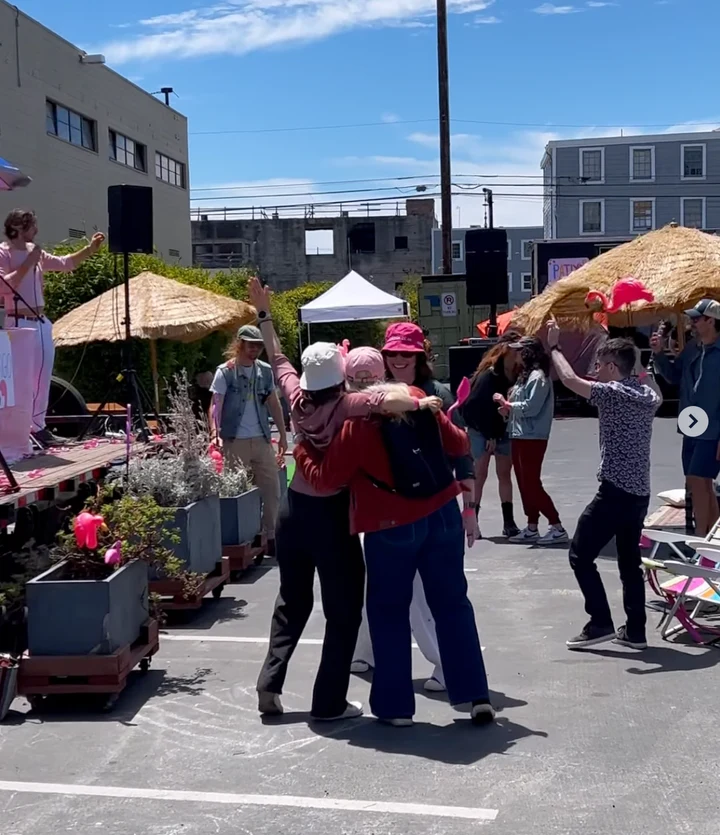 Dancing at an outdoor Rice Cracker pop up
